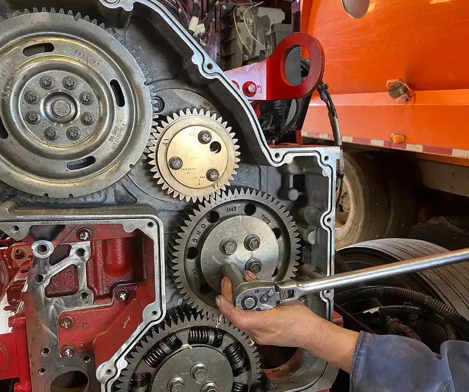 Man Fixing a Truck Engine - TRICO Heavy Duty Truck Parts and Service
